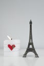 ValentineÃÂ´s Day Composition with Candle and Eiffel Tower Souvenir