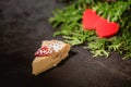 Cheesecake on Valentine`s Day with strawberry, kiwi hearts on fir and wood background