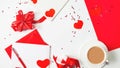 Valentine`s day composition with coffee cup and box of paper red hearts on white background. from above. Space for text. Love and Royalty Free Stock Photo