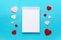 Valentine\'s day composition with notebook list and hearts on blue background