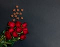 Valentine`s day concept. Border of chocolate candies and red roses Royalty Free Stock Photo