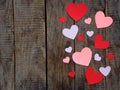 Valentine`s Day concept. Composition of paper colourful hearts on wooden background. Royalty Free Stock Photo