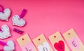 Valentine`s day holiday. lovely hand made decorations for a valentine day on pink background. i love you labels and origami heart Royalty Free Stock Photo