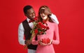 Valentine`s day concept. happy young couple with heart, flowers Royalty Free Stock Photo