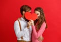 Valentine`s day concept. happy young couple with heart, flowers Royalty Free Stock Photo