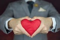 Valentine's day concept, man carries red heart Royalty Free Stock Photo