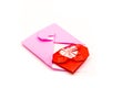 Pink origami envelope with red paper heart isolated on white Royalty Free Stock Photo