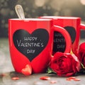 Valentine's Day concept with Red Cups and roses on a Wooden Background Royalty Free Stock Photo