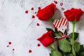 Valentine`s Day Concept. Red roses and heart decor on Ultimate Gray background.