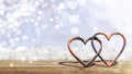 Valentine`s day. Rusty attached hearts on blur snow background, banner, copy space. 3d illustration