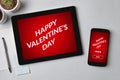 Valentine`s day concept on tablet and smartphone screen