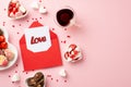 Valentine`s Day concept. Top view photo of heart shaped saucers with sweets chocolate candies glass cup of beverage and red open Royalty Free Stock Photo