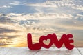 Valentine`s day concept : word love in red letters on wood table Royalty Free Stock Photo