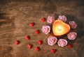 Valentine`s day, dark background candle heart, confetti, pink ro Royalty Free Stock Photo