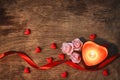 Valentine`s day, dark background candle heart, scarlet ribbon Royalty Free Stock Photo