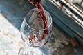 Valentine`s day, date, love, Celebration. pouring red wine. Wine in a glass, selective focus, motion blur, Red wine in a glass. S Royalty Free Stock Photo