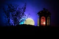 Valentine`s day decor concept. Romantic scene. Big Lantern as lovers house with rising moon on night decor background. Selective f