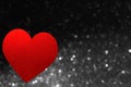 Valentine`s Day decoration. Red heart shape isolated on blurred gray lights. Love background