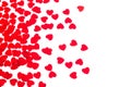 Valentine`s day decorative border of red hearts confetti isolated on white background. Royalty Free Stock Photo