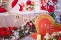 Valentine`s day decorative elements, bird cage, flowers, wooden hearts, lantern and candles. Royalty Free Stock Photo