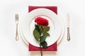 Valentine`s day dinner. Romantic table setting with red rose. View from above