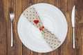 Valentine's day dinner setting, Knife, fork, napkin and plate Royalty Free Stock Photo