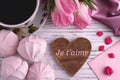 Valentine`s day elegant still life with tulip flowers cup of coffe marshmallows zephyr red heart shape sign on white wooden backgr Royalty Free Stock Photo