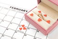 Valentine`s day, February 14 on the calendar with red hearts and gift box