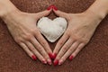 Valentine`s Day, February 14th. Red and white hearts. Fire candles. Red manicure. Frame. Background. Light, brilliant. Hearts mad Royalty Free Stock Photo