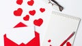 Valentine`s Day. Flat lay of red hearts, love letter, notebook for writing on a white background. copy space. The concept of Royalty Free Stock Photo