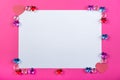 Valentine`s day frame on pink background made of pebbles in the shape of a heart with white space. Royalty Free Stock Photo