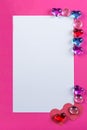 Valentine`s day frame on pink background made of pebbles in the shape of a heart with white space. Royalty Free Stock Photo