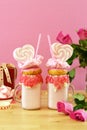 Valentine`s Day freak shakes with heart shaped lollipops and donuts.