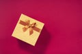 Valentine`s Day. Golden gift box on green background. Top view. Copy space. Festive backdrop for holidays: Birthday Royalty Free Stock Photo