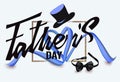 Father`s Day composition with heart shaped ribbon and fathers objects.