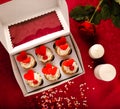 Valentine`s day greeting card. Sweet Valentine`s creative dessert food. Homemade pink and red delicious cupcakes with