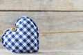 Heart made of fabric on wooden background