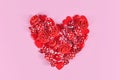 Valentine`s day heart shaped out of candy, red roses, hearts and sugar sprinkles Royalty Free Stock Photo