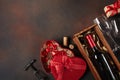 Valentine`s Day with hearts, wine, corkscrew, glasses, gifts, a heart-shaped box and a blackboard