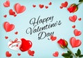 Valentine`s Day holiday background with red roses and paper hearts Royalty Free Stock Photo