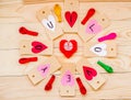 Valentine`s day holiday. hand made paper hearts labels on rustic background in circle with colorful balloons and red origami hear Royalty Free Stock Photo