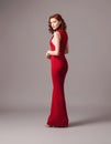 Valentine's day look idea. Sexy ginger woman in bright red fitting dress. WomenÃ¢â¬â¢s fashion concept.