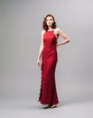 Valentine's day look idea. Sexy ginger woman in bright red jumpsuit. WomenÃ¢â¬â¢s clothing, fashion concept.