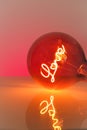 Valentine's Day. Love light bulb.Turning on a light bulb.red Light bulb with the inscription love on a red background