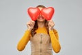Happy teenage girl with red heart-shaped balloons Royalty Free Stock Photo