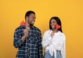 Valentine's day, love, romance and relationships. Smiling young african american male and female look at each other