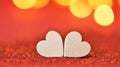 Valentine's Day. Love symbol. two white hearts on a red glitter background with gold bokeh. Valentines day background in Royalty Free Stock Photo