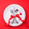 Valentine`s Day meal design concept - Romantic plate dish set isolated on red background for restaurant, holiday celebration Royalty Free Stock Photo