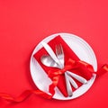 Valentine`s Day meal design concept - Romantic plate dish set isolated on red background for restaurant, holiday celebration Royalty Free Stock Photo