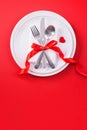 Valentine`s Day meal design concept - Romantic plate dish set isolated on red background for restaurant, holiday celebration Royalty Free Stock Photo